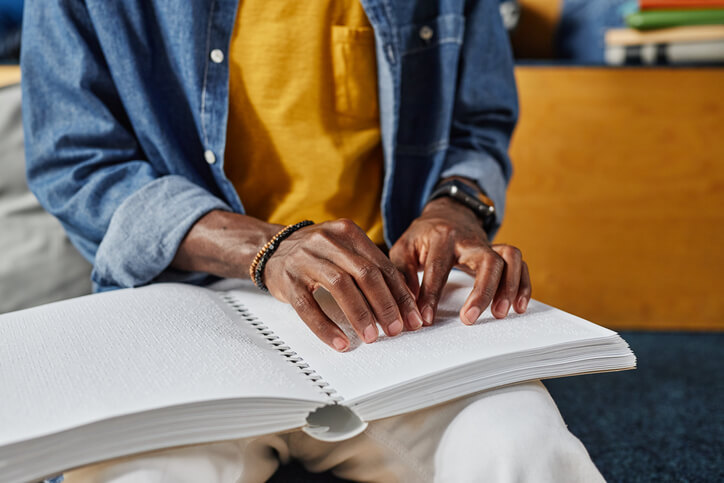 Person reading braille