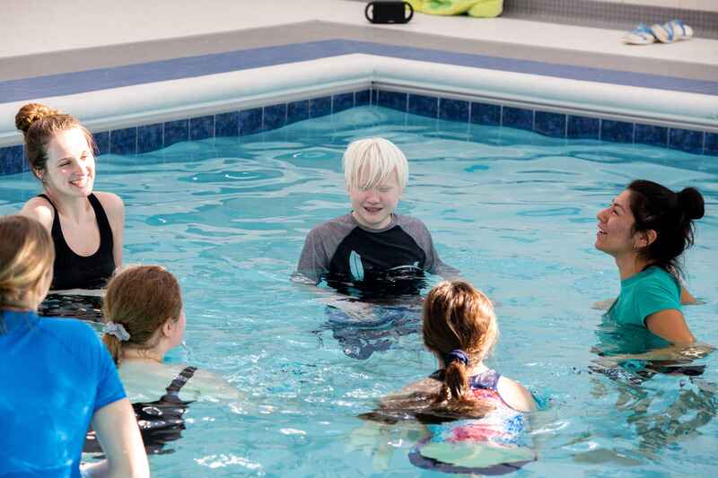 group of people swimming together