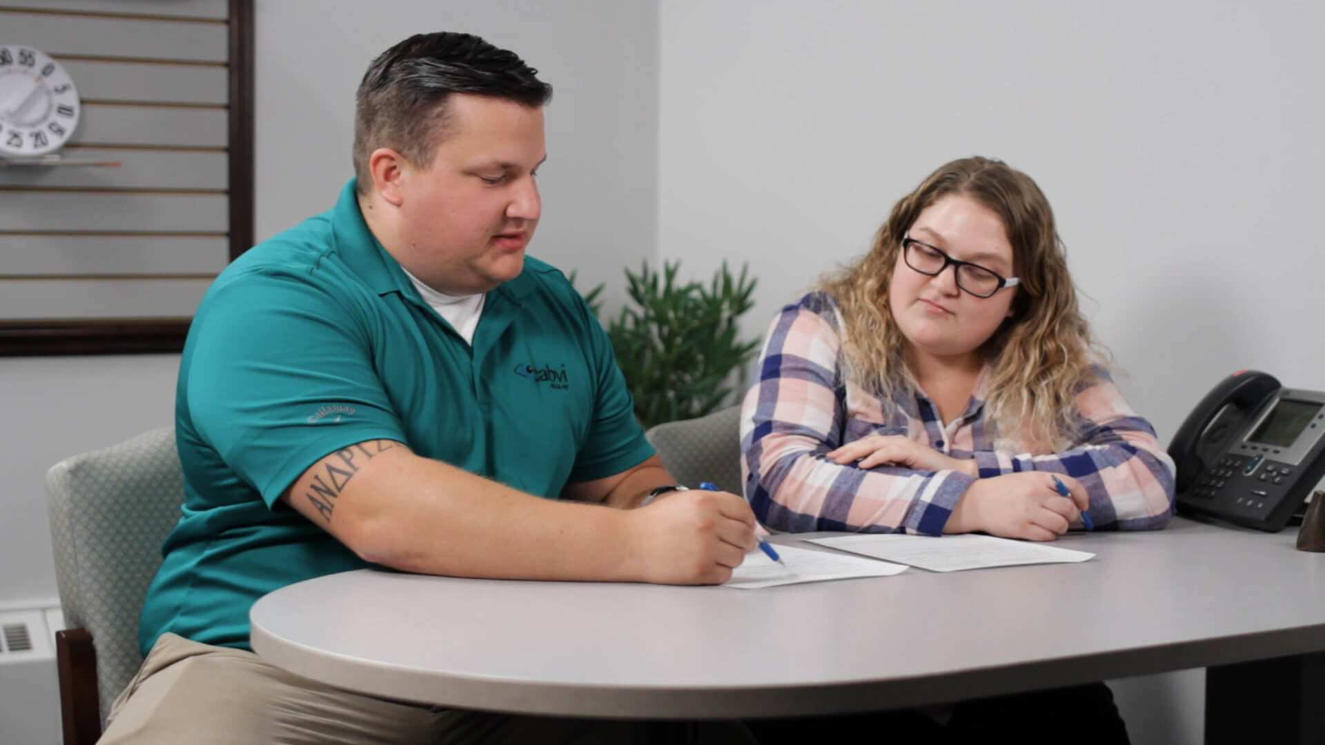 A man and woman going over paperwork