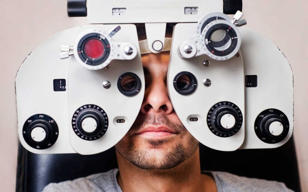 A man having his eyes examined with medical equipment