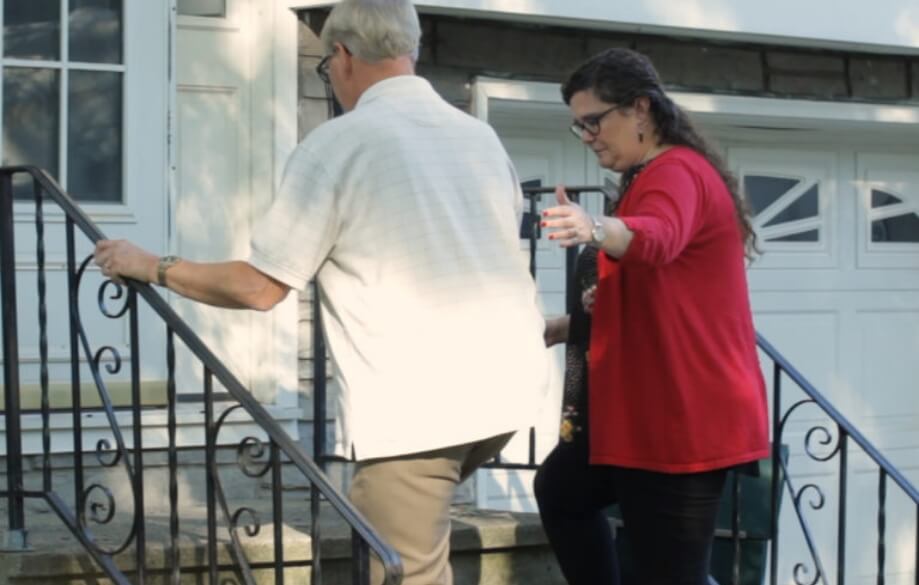 Two people walking up stairs